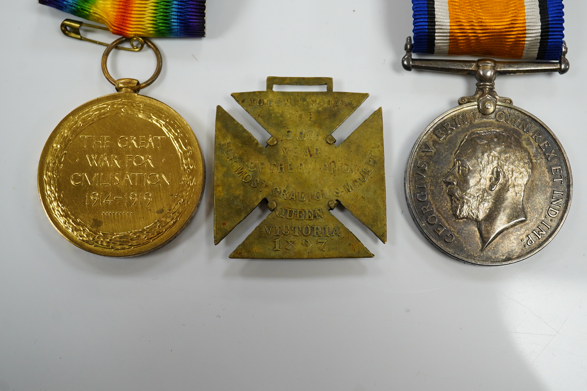 A First World War middle group awarded to A. SJT. E.E. Bogardis 24-CAN. INF. comprising of a medal pair and an 1897 Diamond Jubilee medal for Queen Victoria. Condition - poor to fair